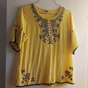 Short Bell sleeve embroidered top.